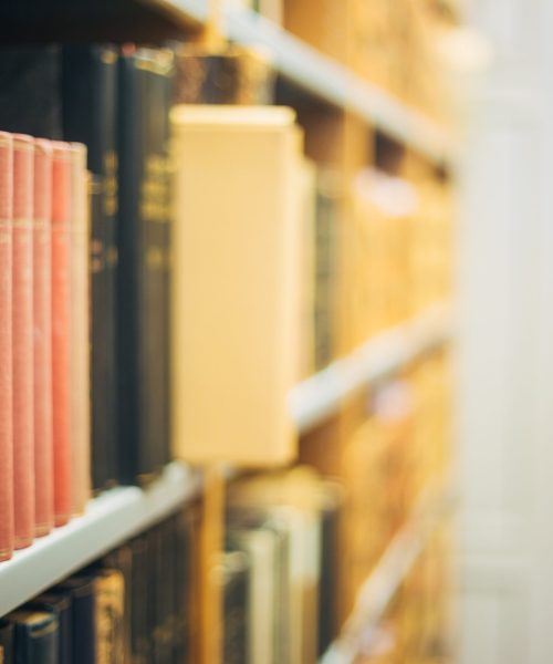 The Collection Of Old Scarce Editions Of Retro Books In Vintage Hardcovers Exposed On The Shelfs Of Library. Copy Space.
